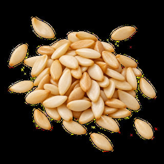 Pile of raw blanched peanuts scattered on a black background
